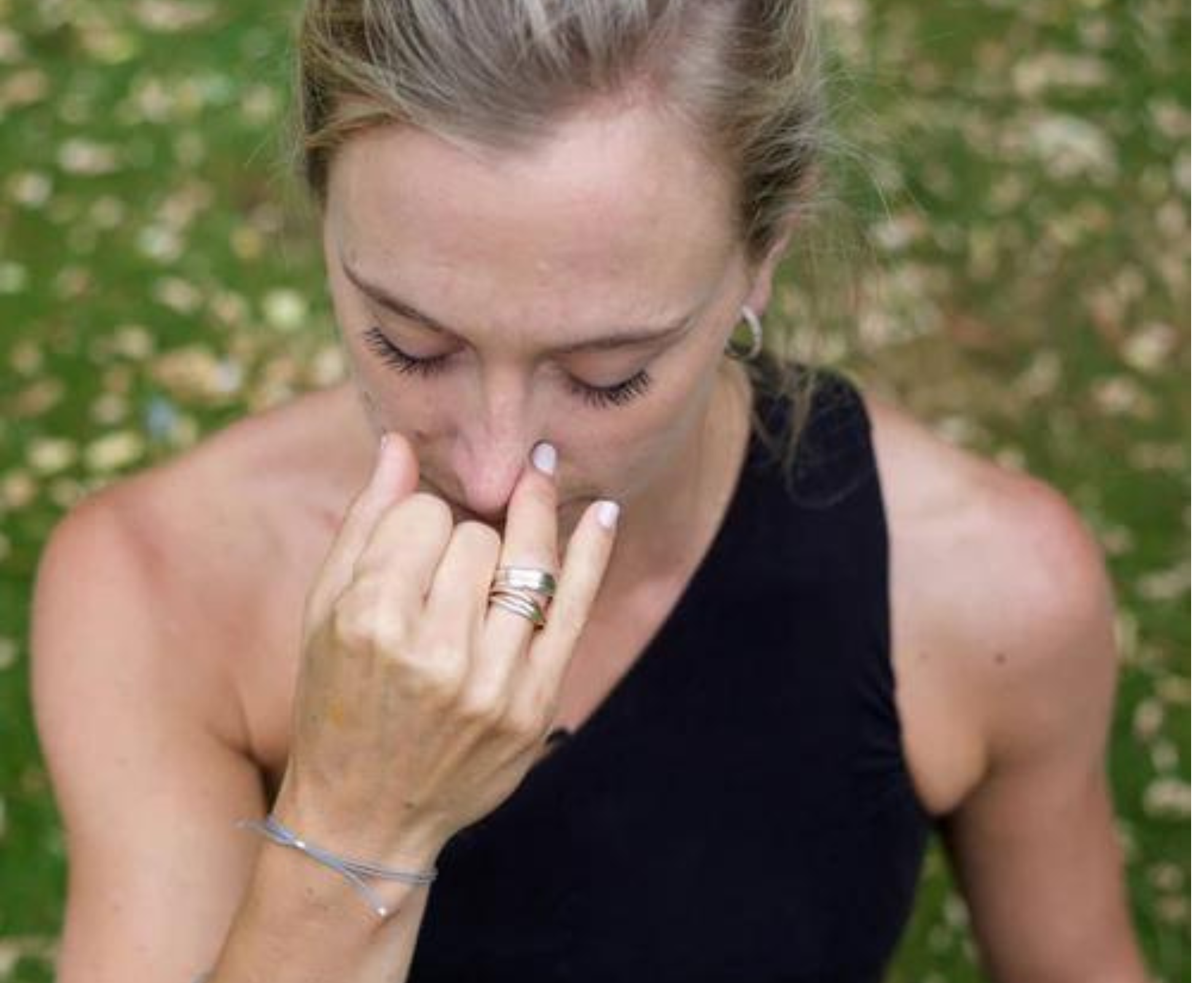 Women holding her nose