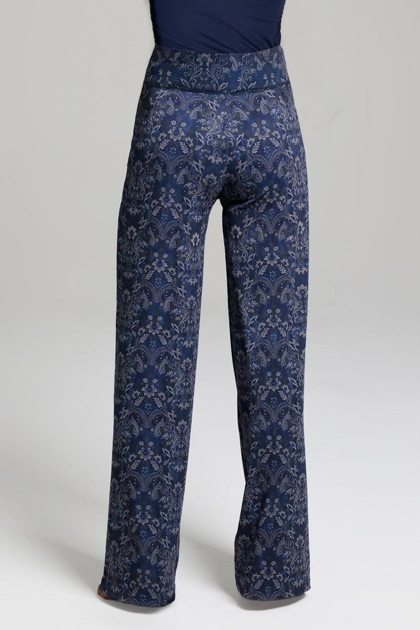 Back view of a woman wearing navy medallion high waisted pants