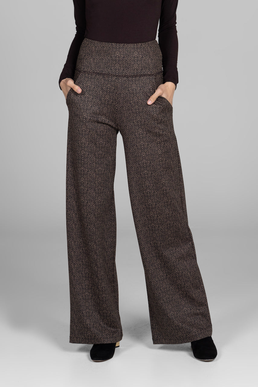 Woman wearing brown herringbone printed high waist wide leg pants