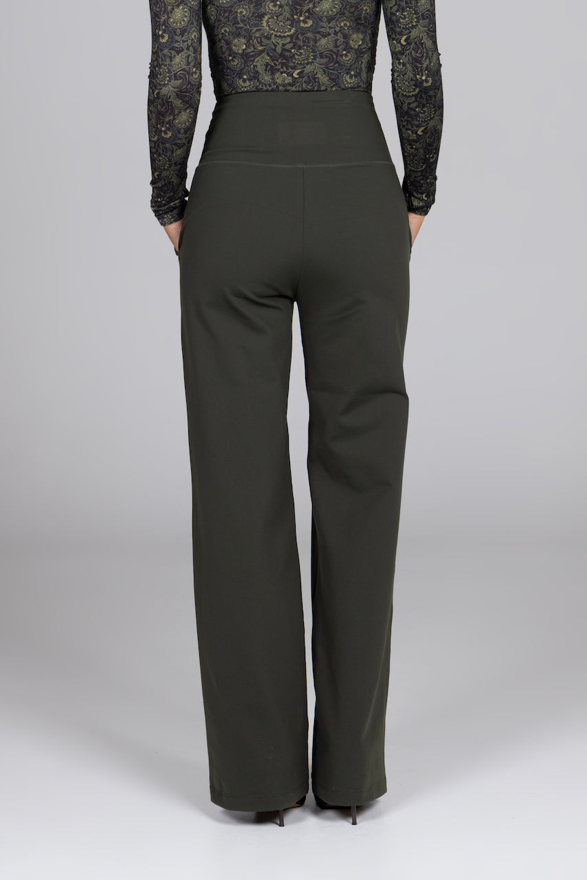 Woman wearing green high waist wide leg pants