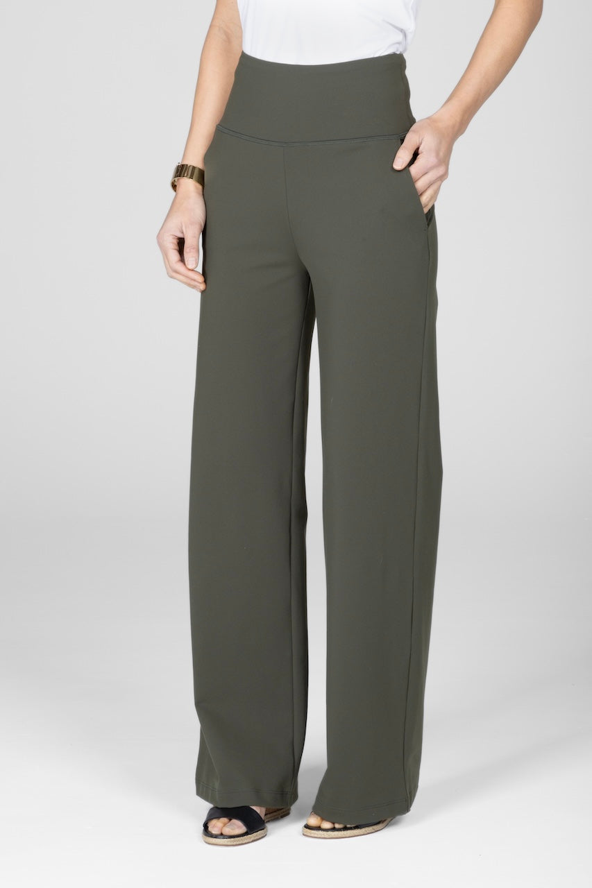 Side view of high waist wide leg pant with hand in front pocket