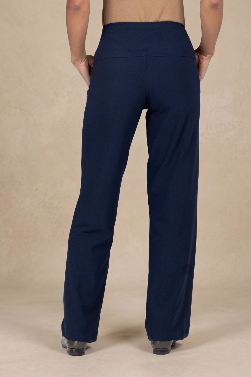 Navy blue pants worn by a person on a beige background