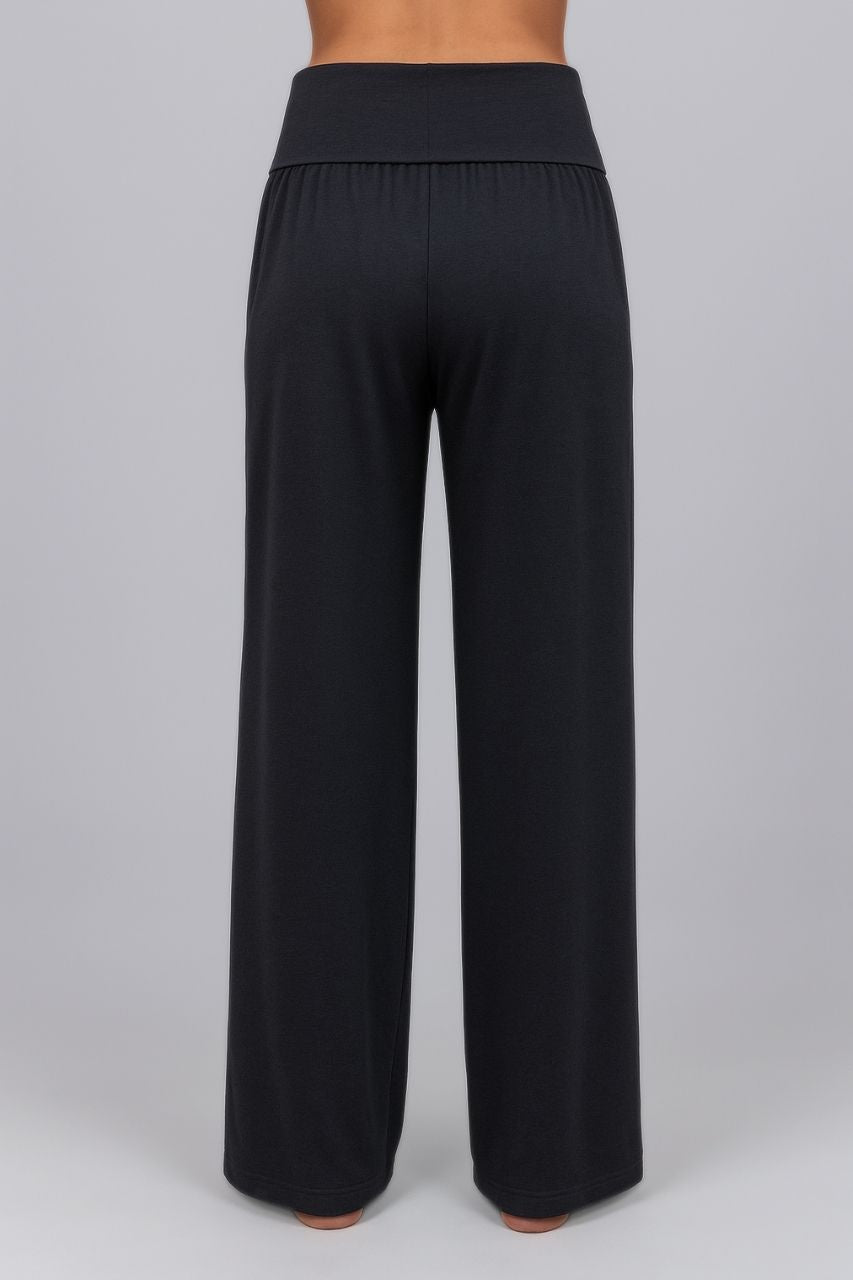 Back view of black wide-leg pants on a gray background