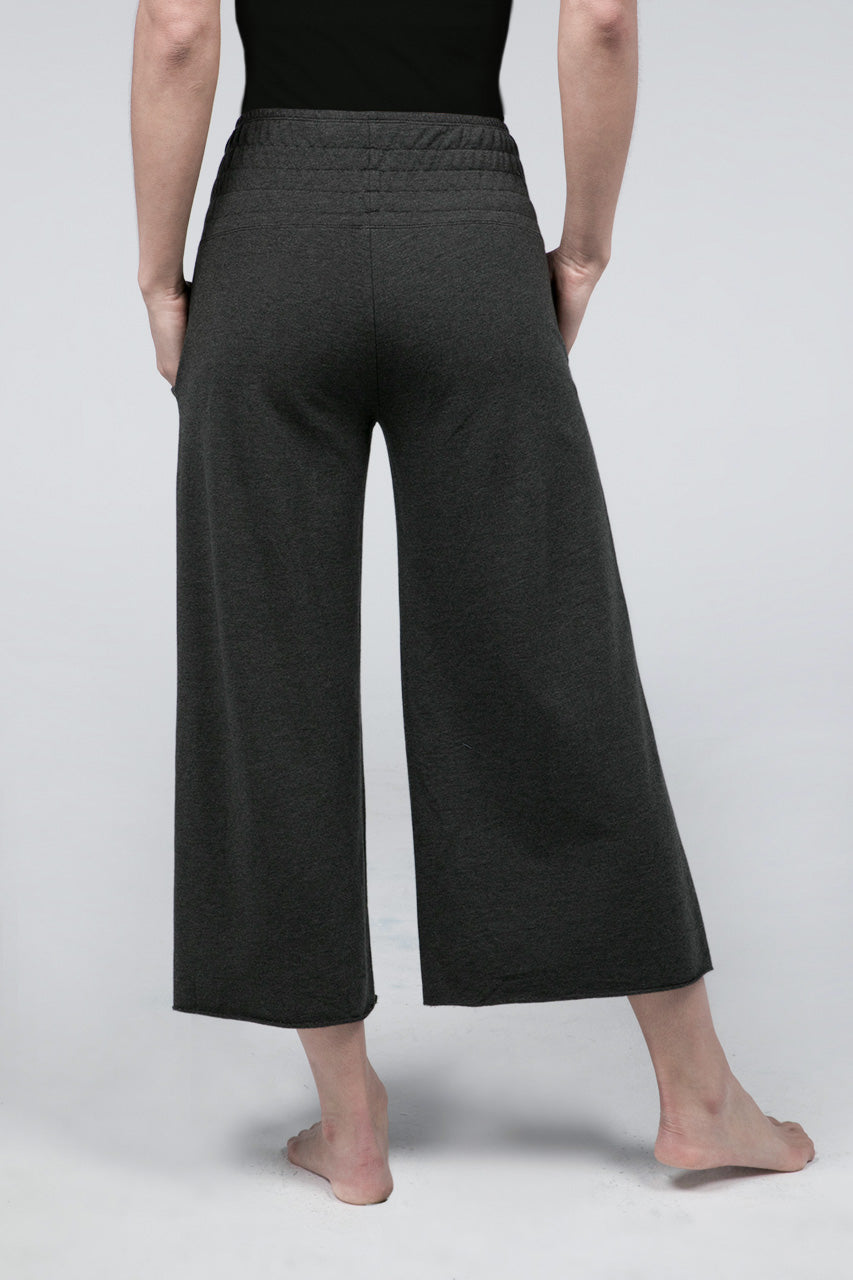Back view of charcoal heather cropped pants with smocked waistband