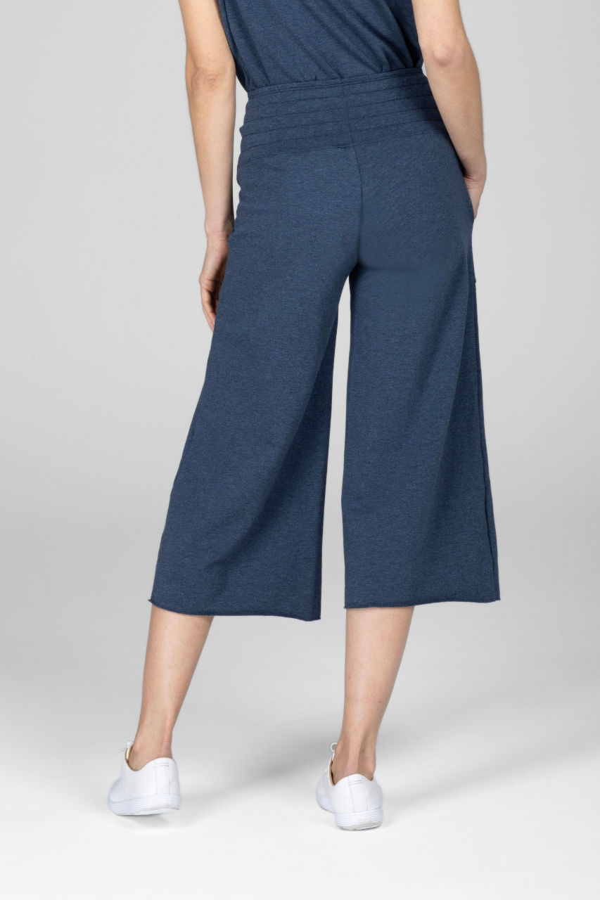 Back view of woman wearing blue cropped lounge pants