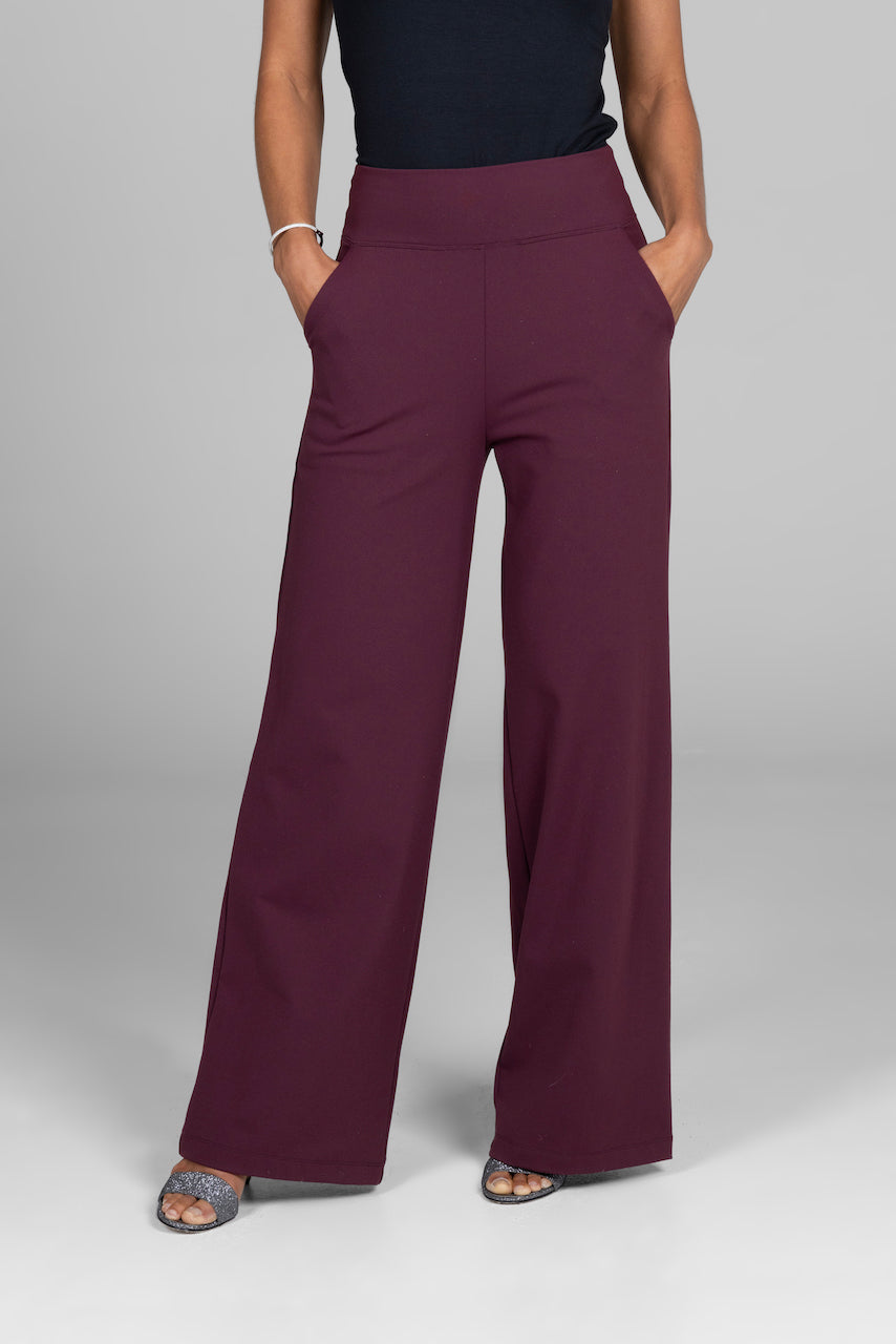 Woman wearing burgundy high waist wide leg pants