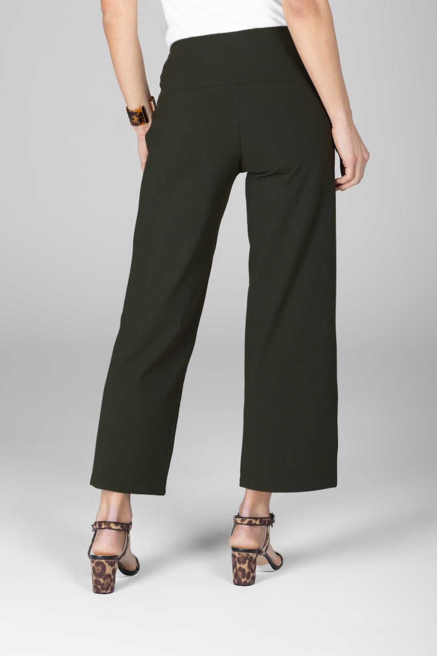 Back view of woman wearing green ankle pants