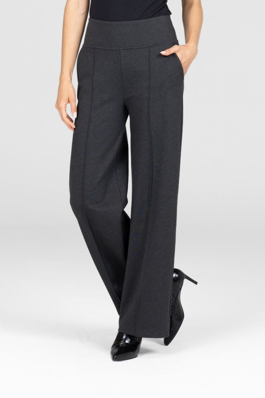 Woman wearing gray high waist wide-leg pants with pintucks on a white background