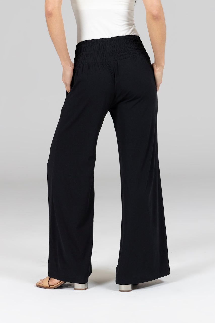 Back view of woman wearing high waisted wide leg pants