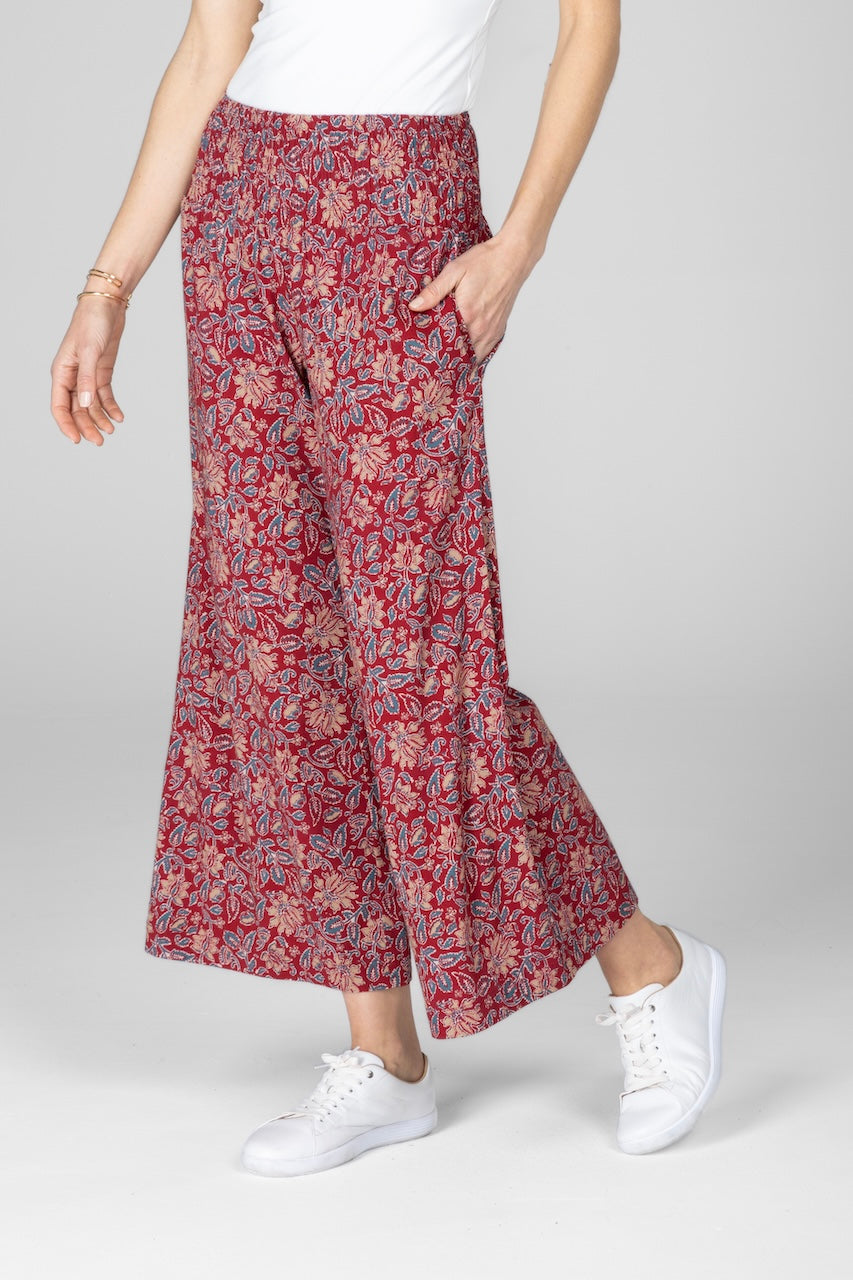 Woman wearing red motif high rise ankle pants side view