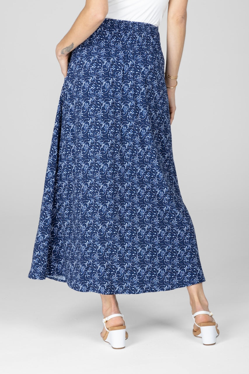 Back view of woman wearing blue vines maxi skirt