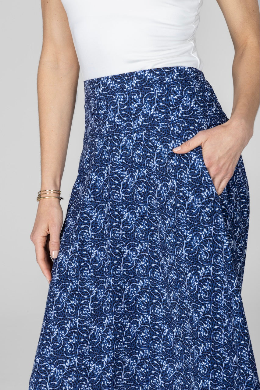 Close up of woman wearing blue vines printed maxi skirt