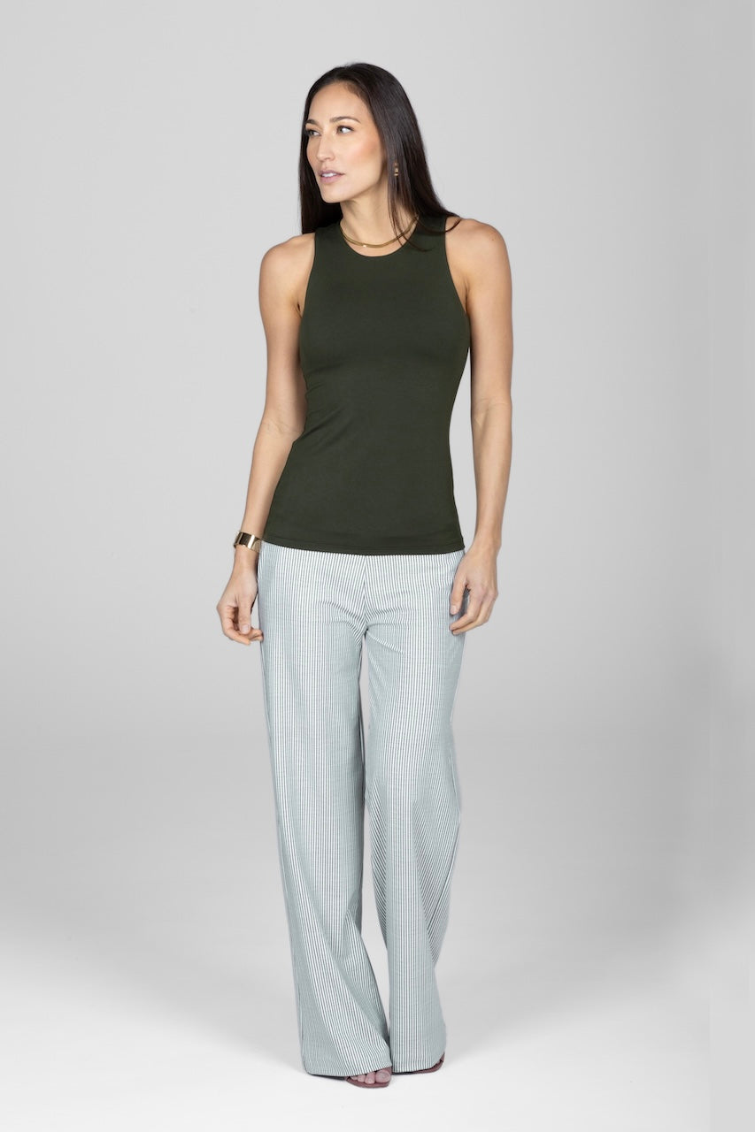 Woman wearing green tank with olive green striped wide leg pants