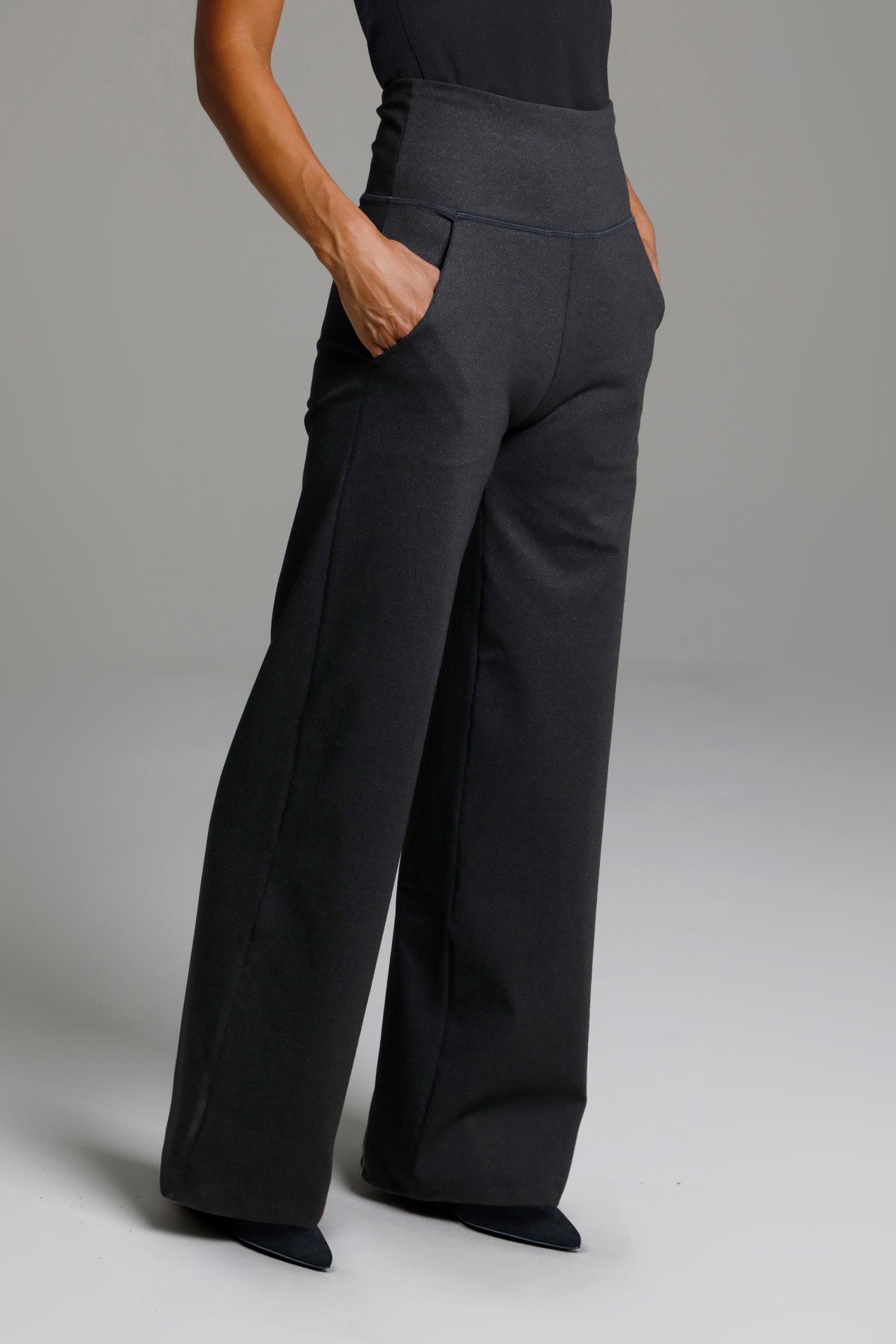 Side view of High Waist Wide Leg Pant with hands in front pocket