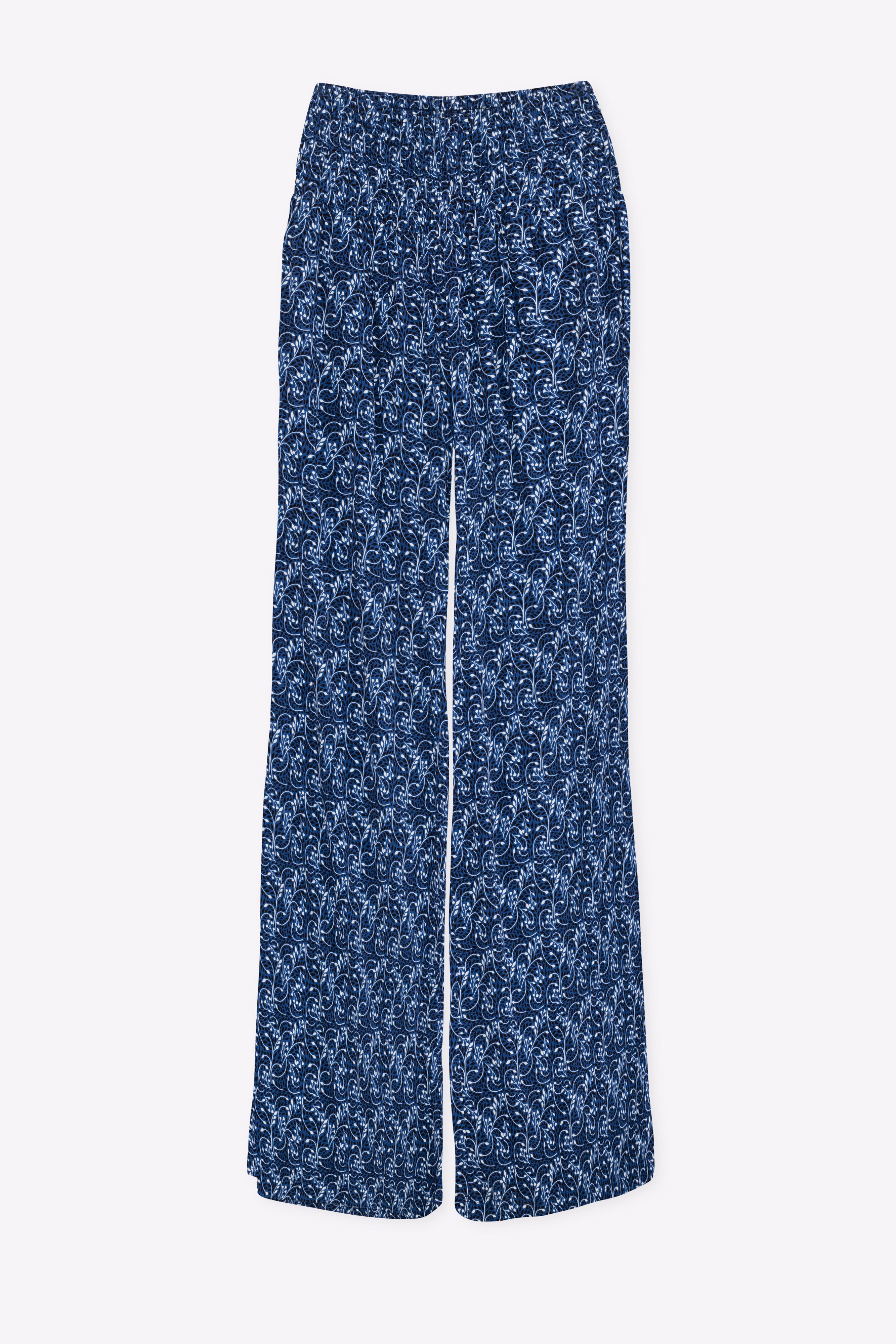 Blue floral patterned pants on a white background