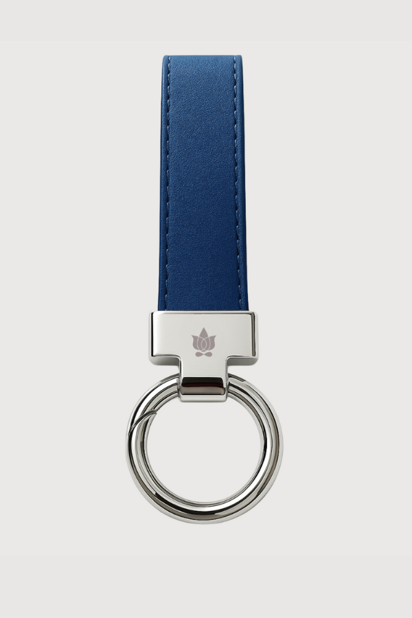 Keychain with blue strap and silver ring on a light gray background