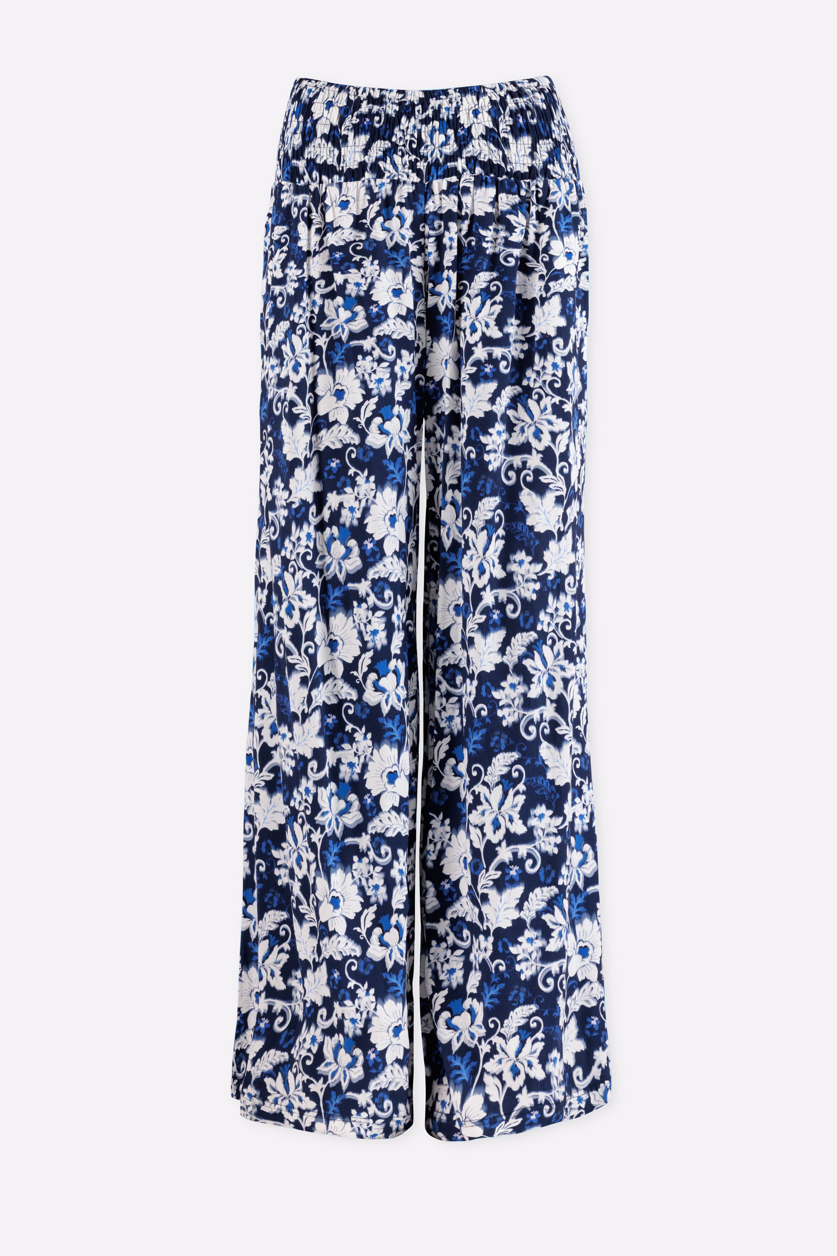 Blue and white floral-patterned pants on a white background