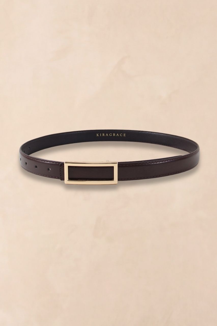 Brown KiraGrace belt on a beige background