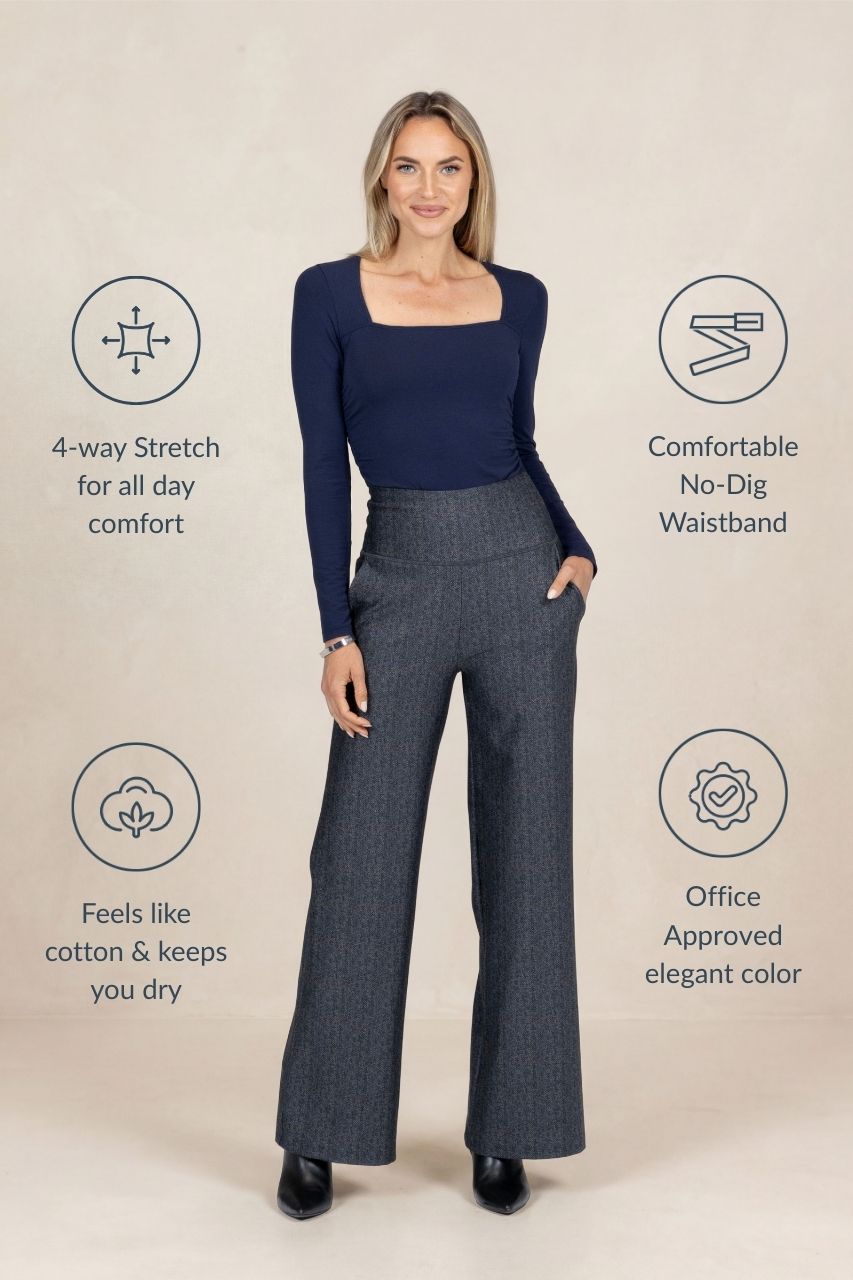 Woman wearing a navy top and gray tartan pants with product features highlighted on a beige background