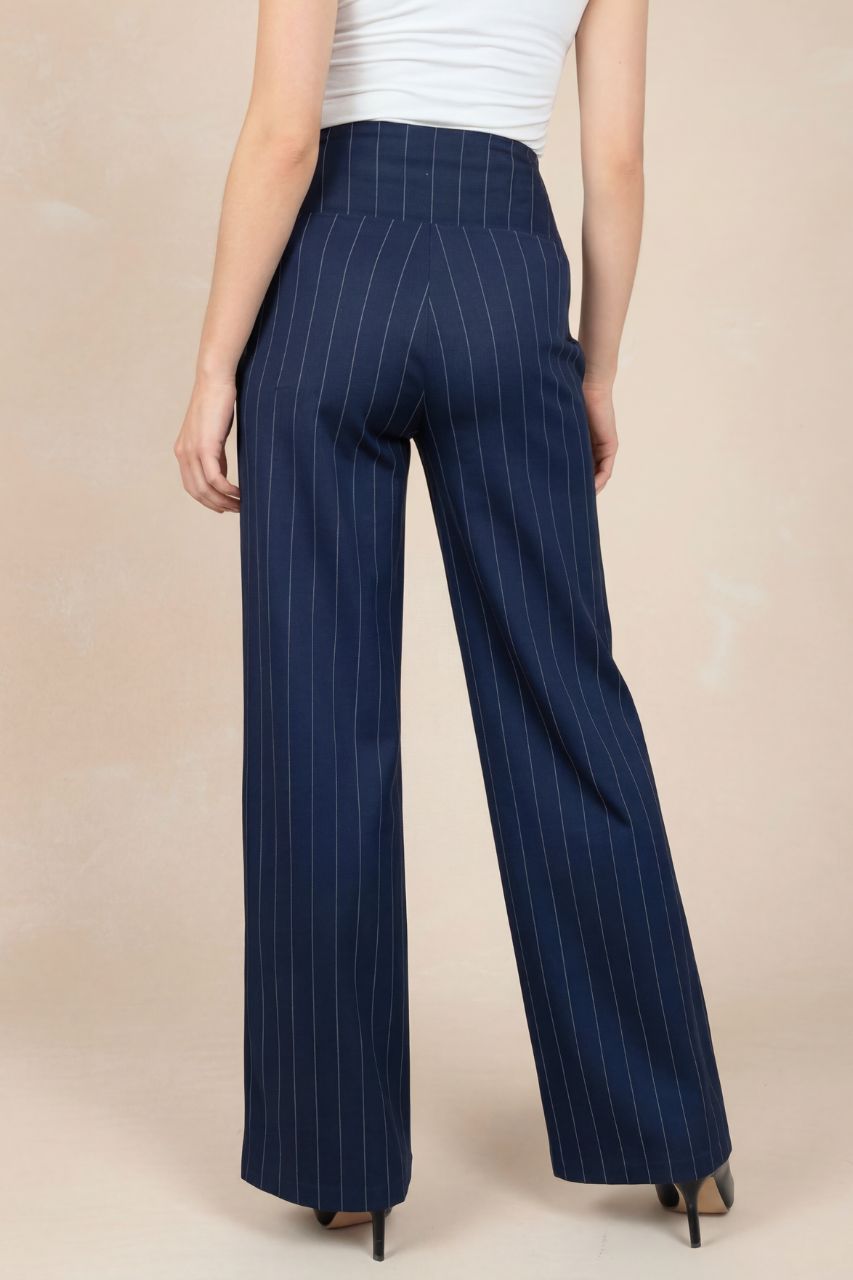 Navy pinstripe pants backview worn by a person on a beige background