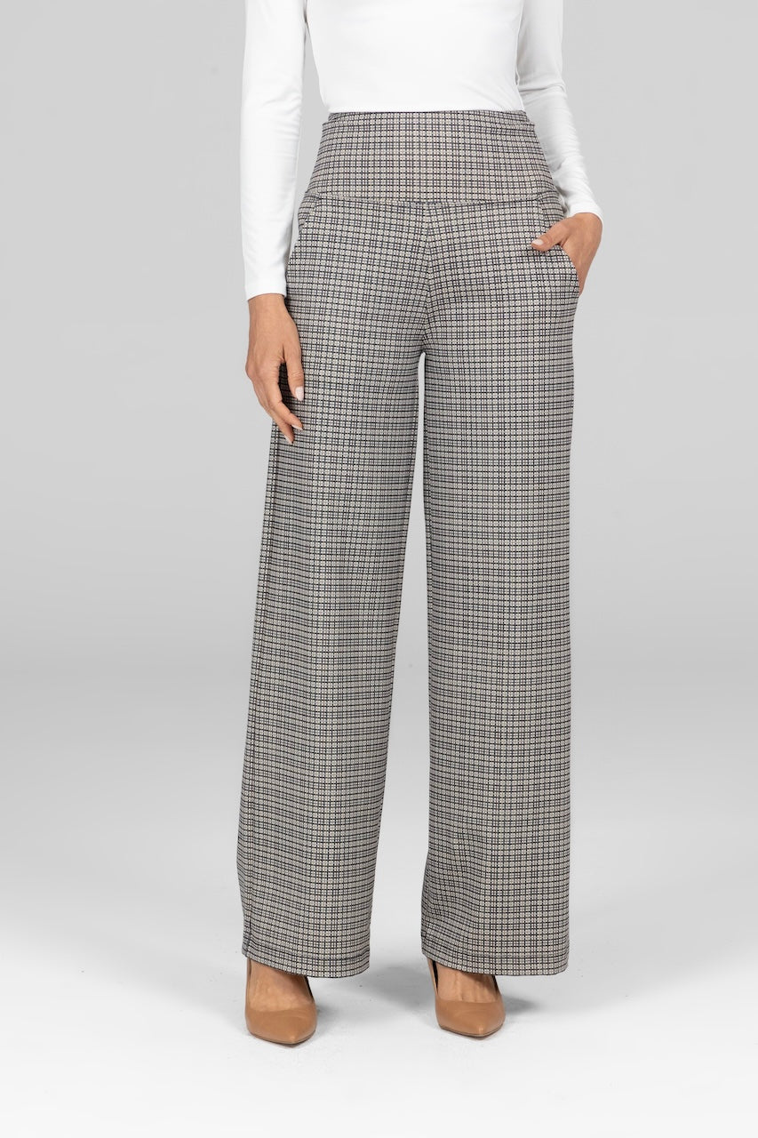Woman wearing high waist wide leg pant with black and white tattersall print