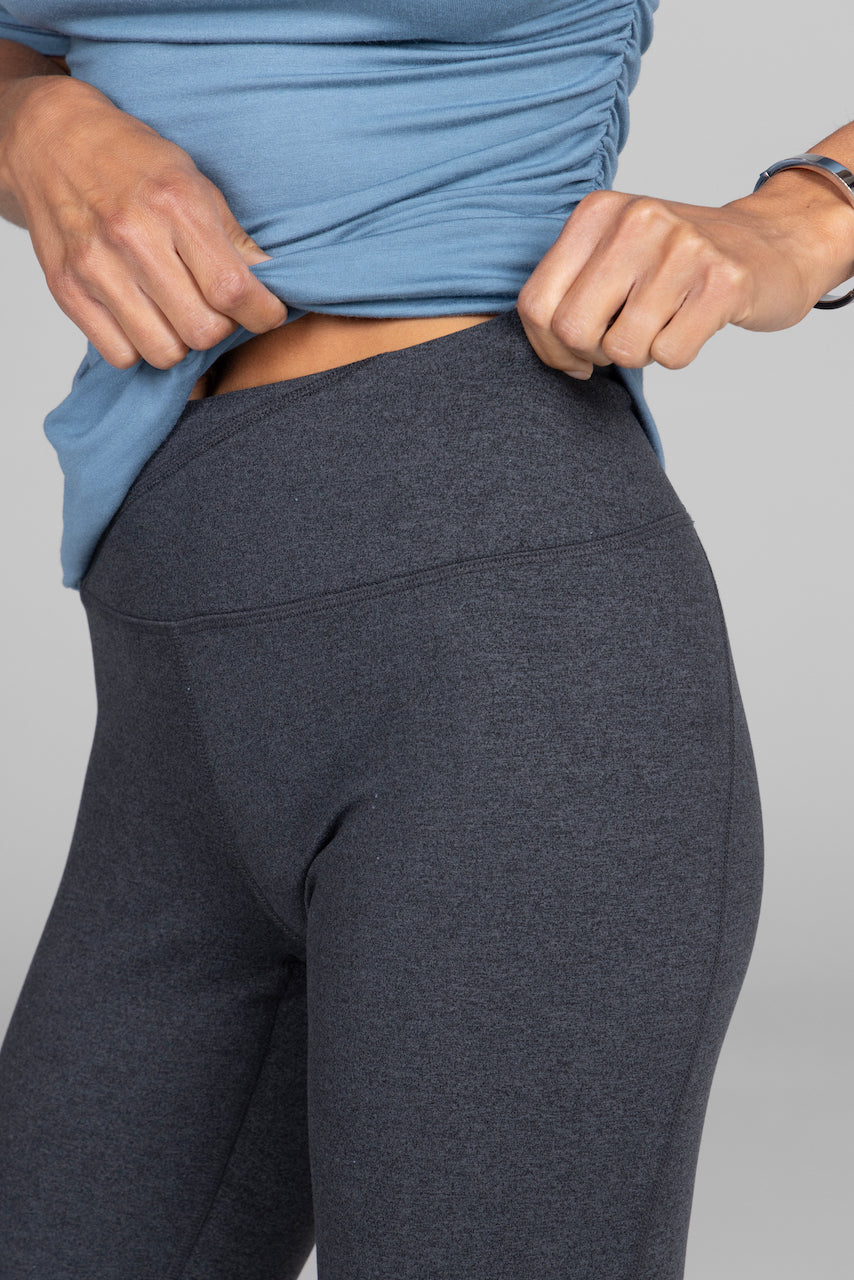 Close-up of the Ultra High Waist Goddess Bootcut in charcoal heather, showcasing the high waistband and its smooth, supportive design