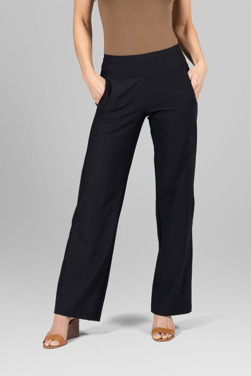 Front view of the High Rise Wide Leg Traveler Pant in black, featuring a flattering high-rise waistband and flowing wide leg design for effortless elegance