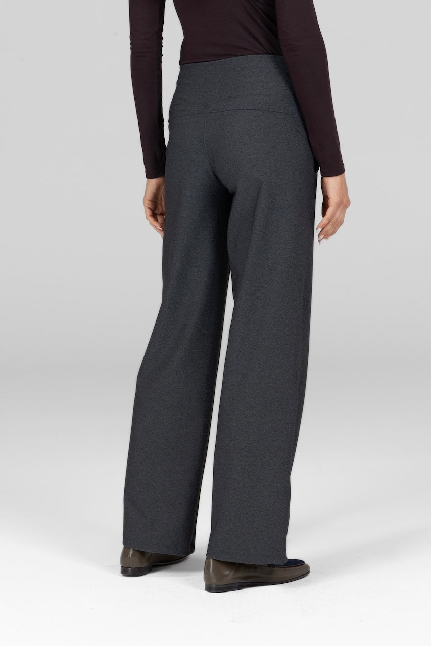 Back view of woman wearing grey wide leg pants
