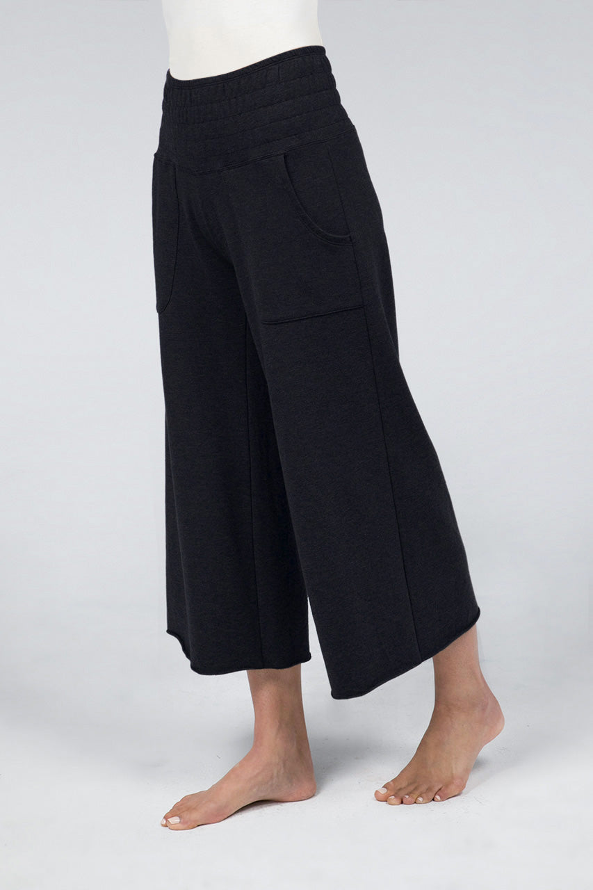Woman wearing black cropped lounge pants