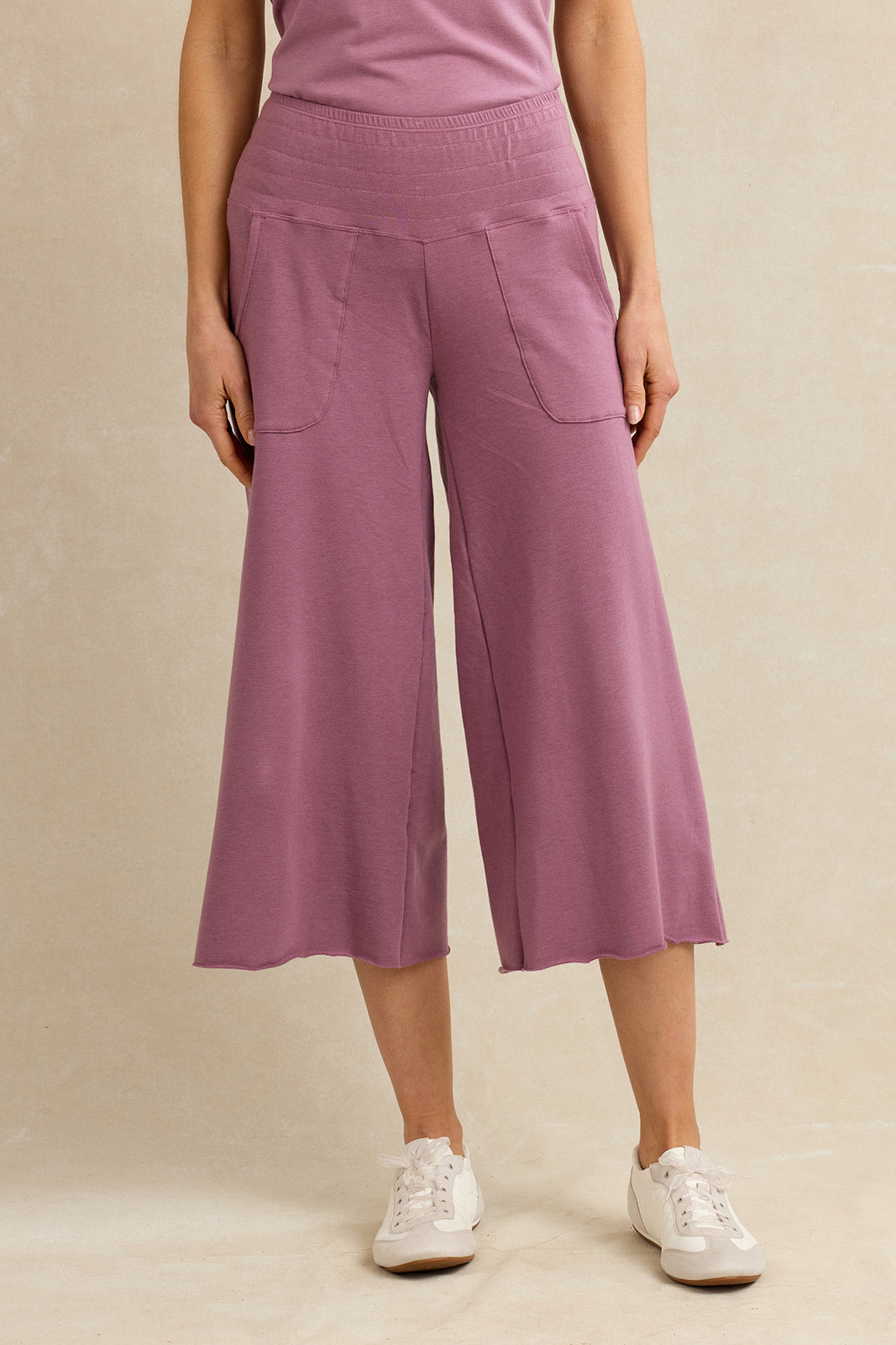 Woman wearing cropped pink lounge pants