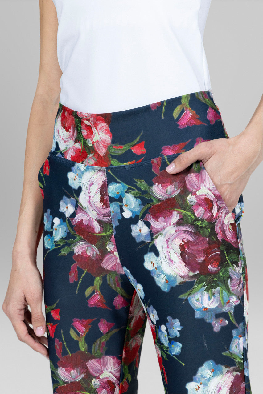 Close-up of the High Waist Ankle Kick Pant featuring a vibrant floral print, highlighting the intricate details and luxurious fabric texture