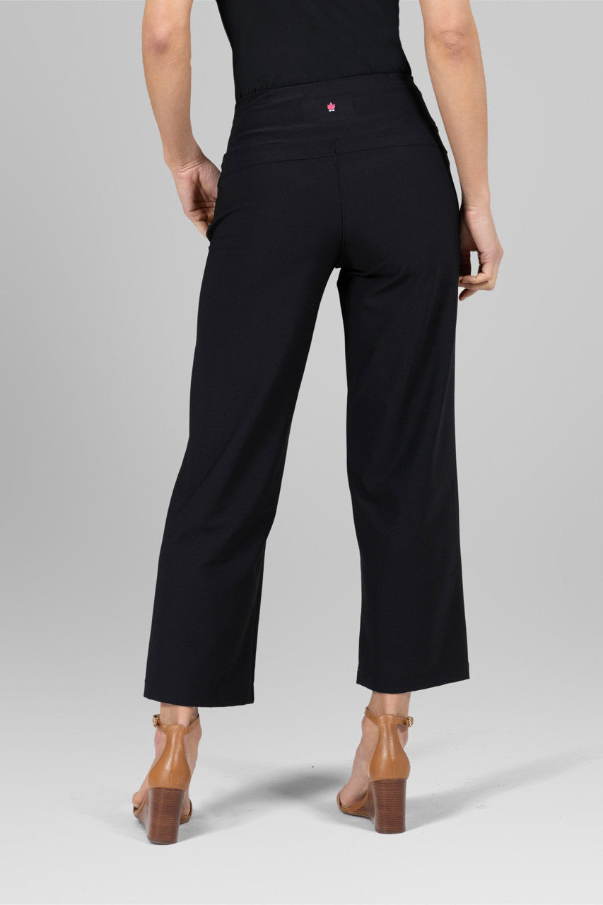 Back view of the Traveler Ankle Pant in black, showcasing the flattering fit and sleek design from behind