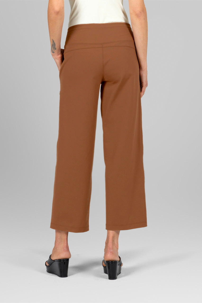 Back view of dark khaki wide-leg ankle pants, showing waistband and relaxed fit.