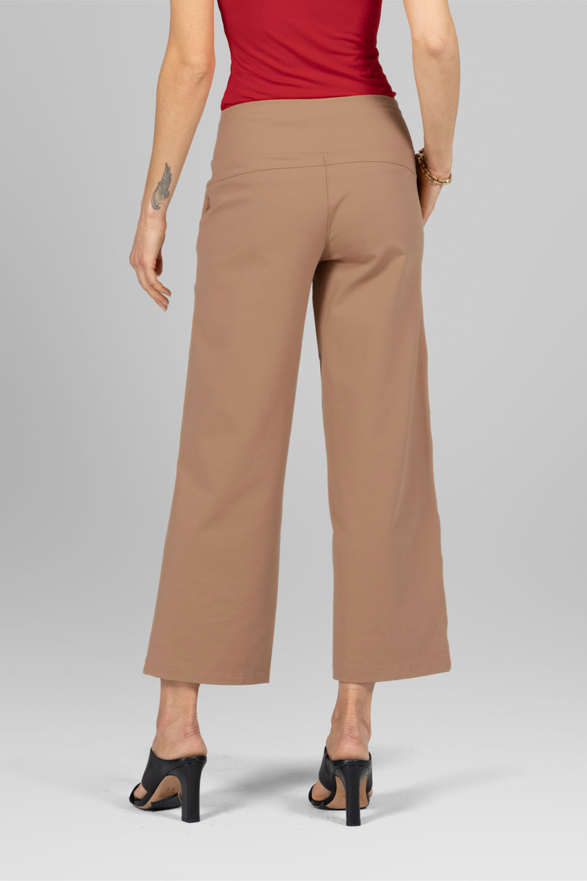 Back view of the Traveler Ankle Pant in khaki, showcasing the flattering fit and elegant design, highlighting the tailored seams and soft fabric.