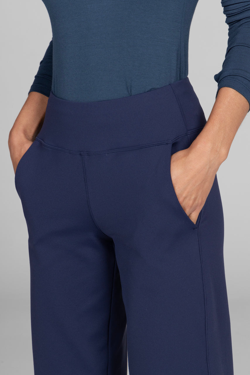 Close-up of the Traveler Ankle Pant in marine navy, highlighting the rich color, fabric texture, and tailored details that enhance its sophisticated design