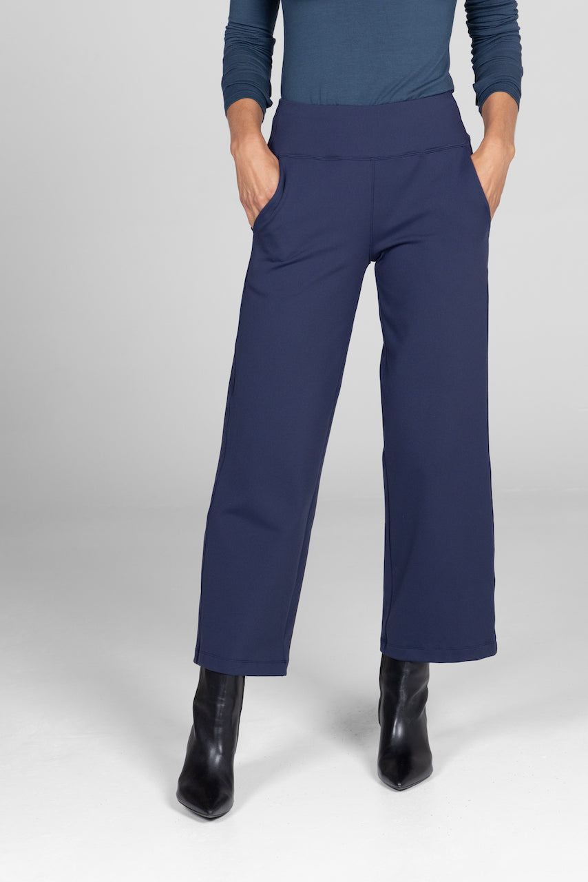 Front view of the Traveler Ankle Pant in marine navy, showcasing the tailored fit and sleek design for a polished appearance