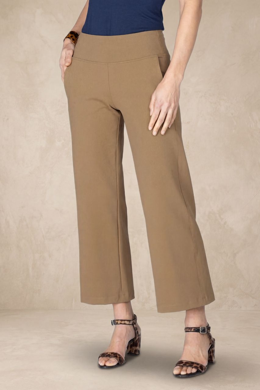 Beige pants worn by a person on a beige background