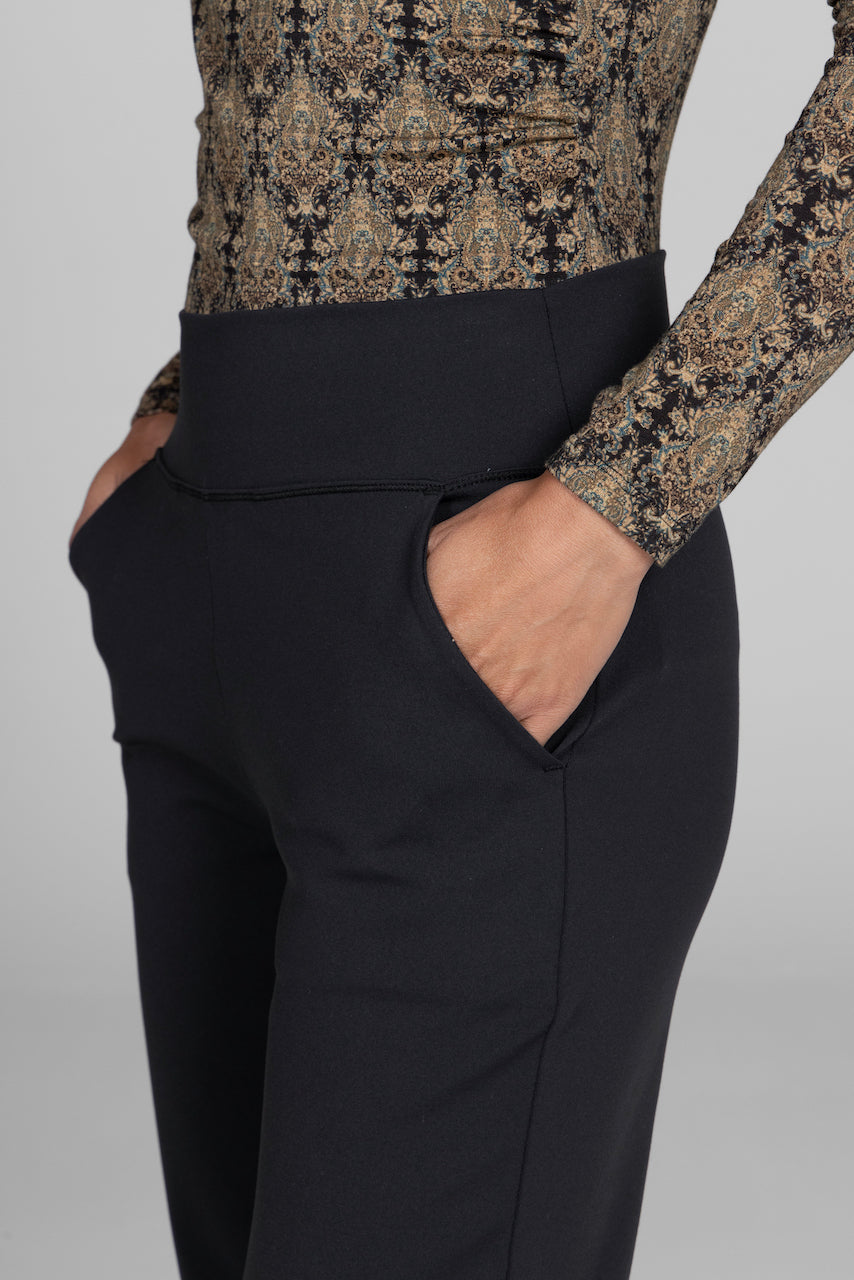 Close-up of the Nina Straight Leg Ankle Pant in black, highlighting the fabric texture and detailing, paired with a printed top for a stylish touch