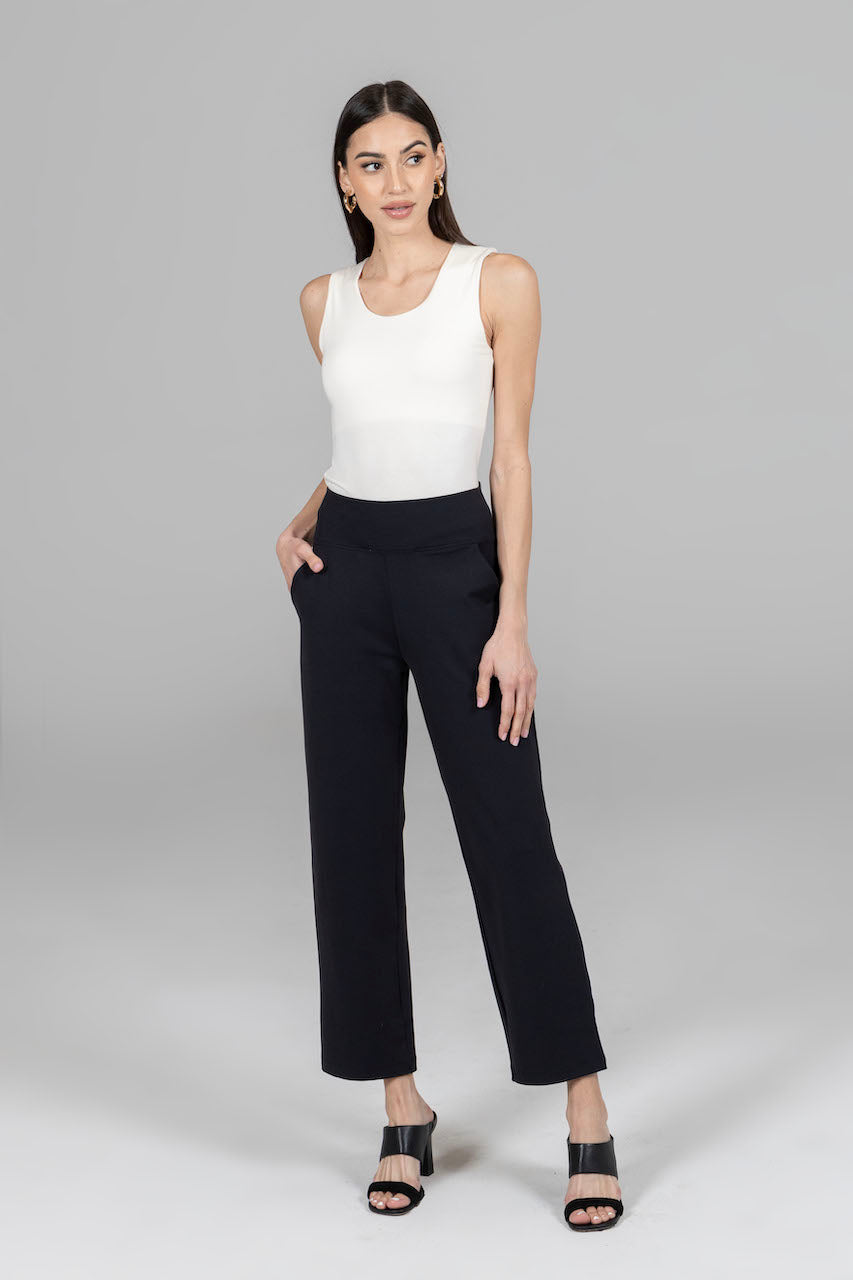 Front view of the Nina Straight Leg Ankle Pant in black, paired with a white top, showcasing a chic and sophisticated outfit perfect for any occasion