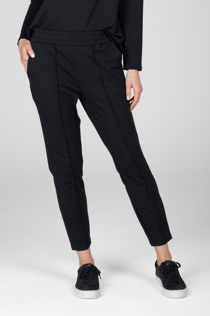Woman wearing black joggers with pockets
