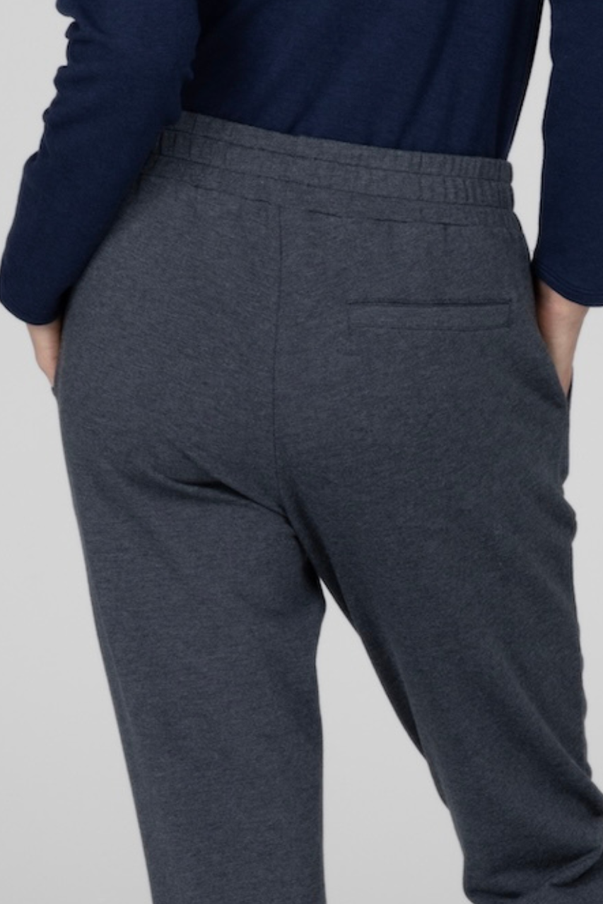 Back close up view of woman wearing charcoal heather joggers