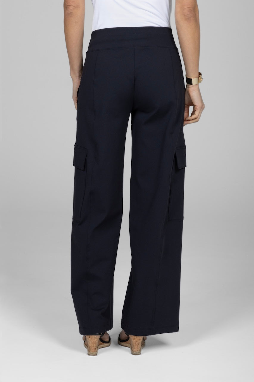 Back view of woman waist down wearing black cargo pants with side pockets