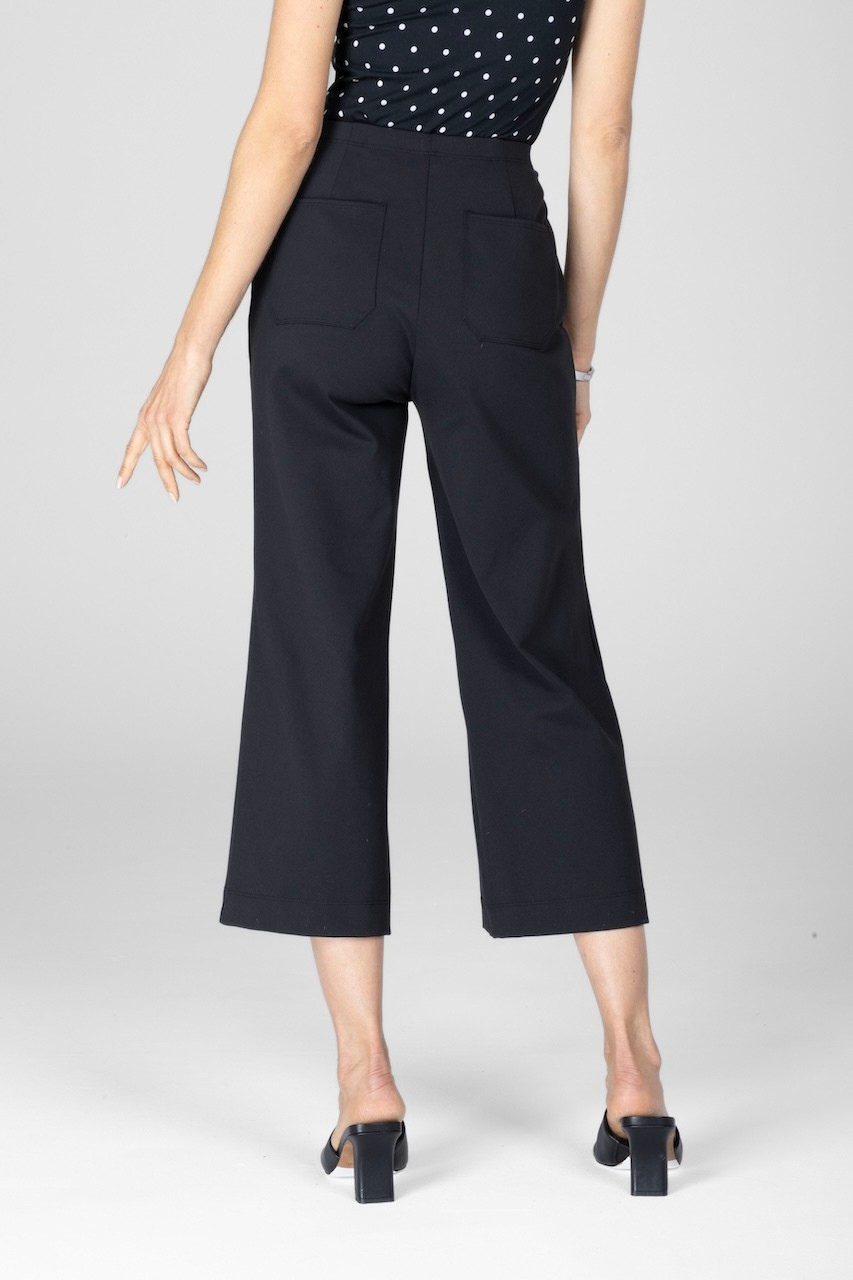 Back view of woman wearing black cropped pants with back pockets