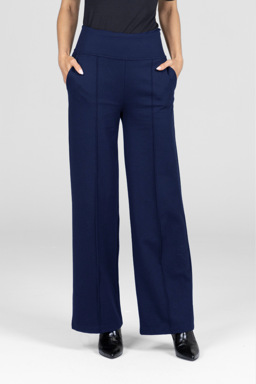Navy blue high waisted wide-leg pants worn by a woman on a white background