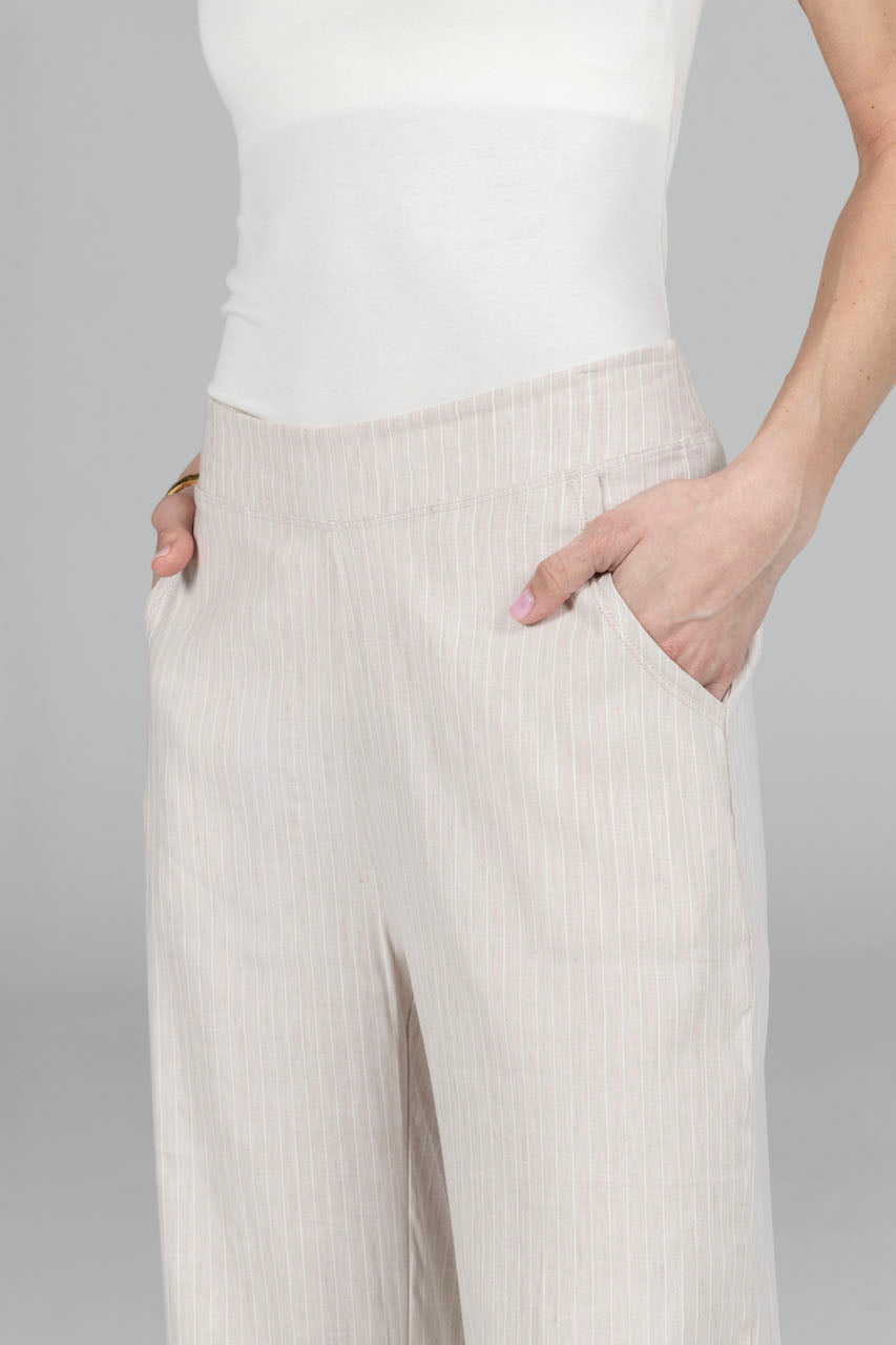 Close up with hands in pocket of RAVELLO LINEN PANT: STRIPE