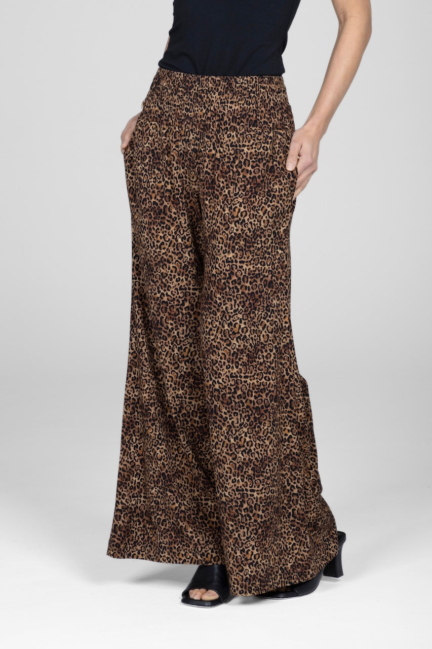 Woman wearing wide leg leopard print pants