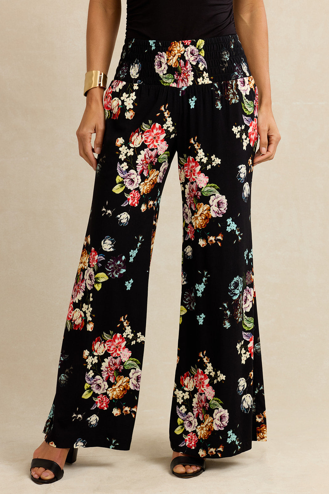 Floral-patterned pants on a neutral background