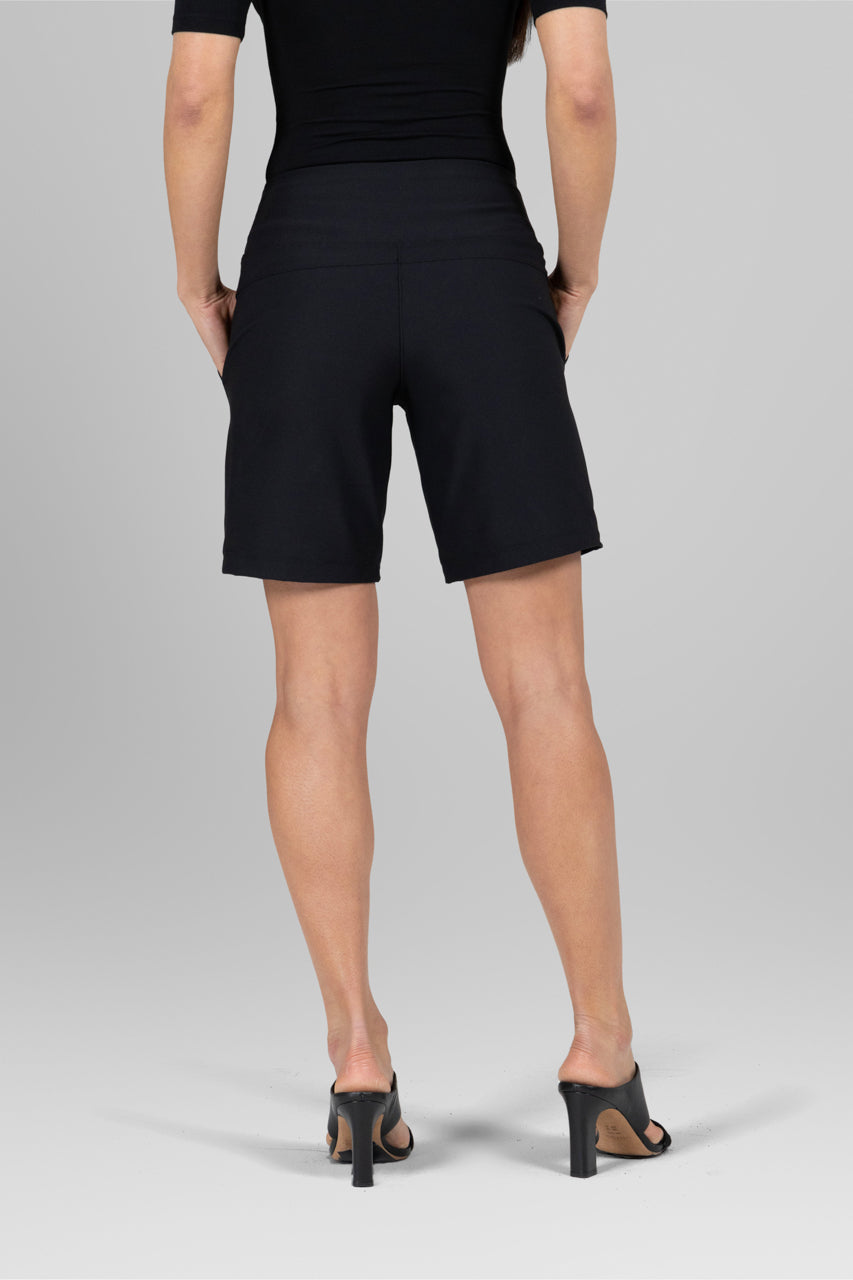 Back view of the Traveler Short in black, showcasing the flattering fit and clean lines for a polished appearance