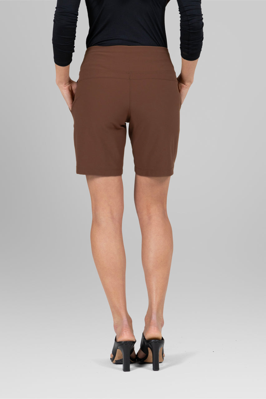 Back view of the Traveler Short in dark khaki, showcasing the flattering fit and clean lines for a polished look