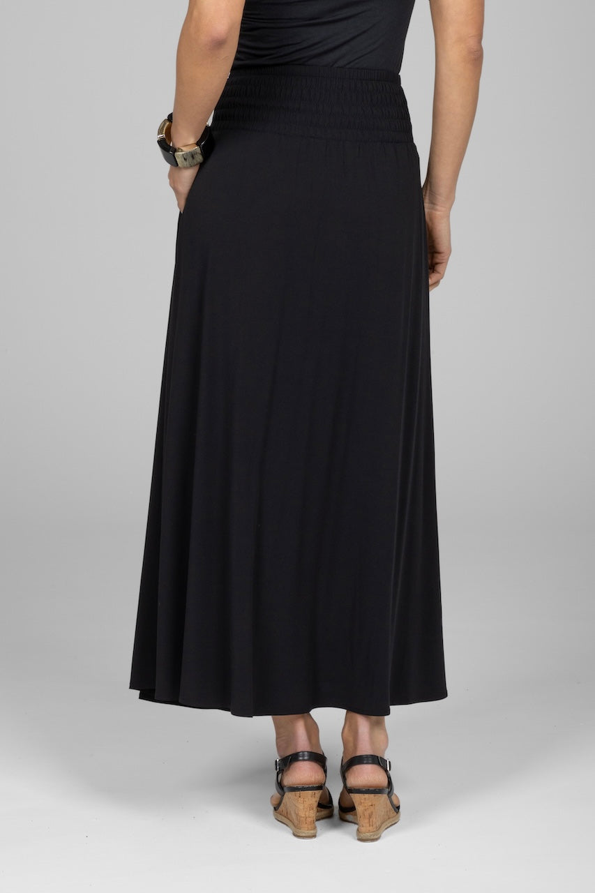 Back view of woman wearing black maxi skirt